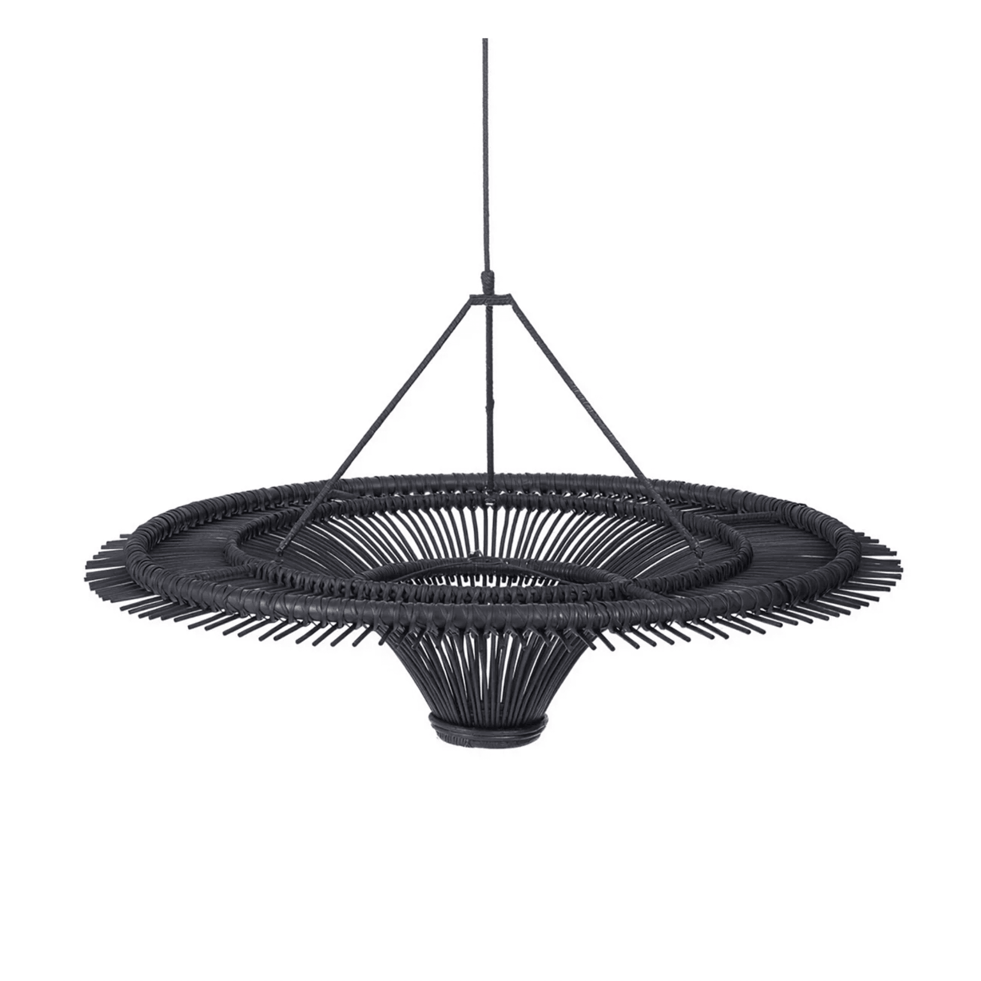Handwoven bamboo pendant light in minimalist style hanging above a modern dining table