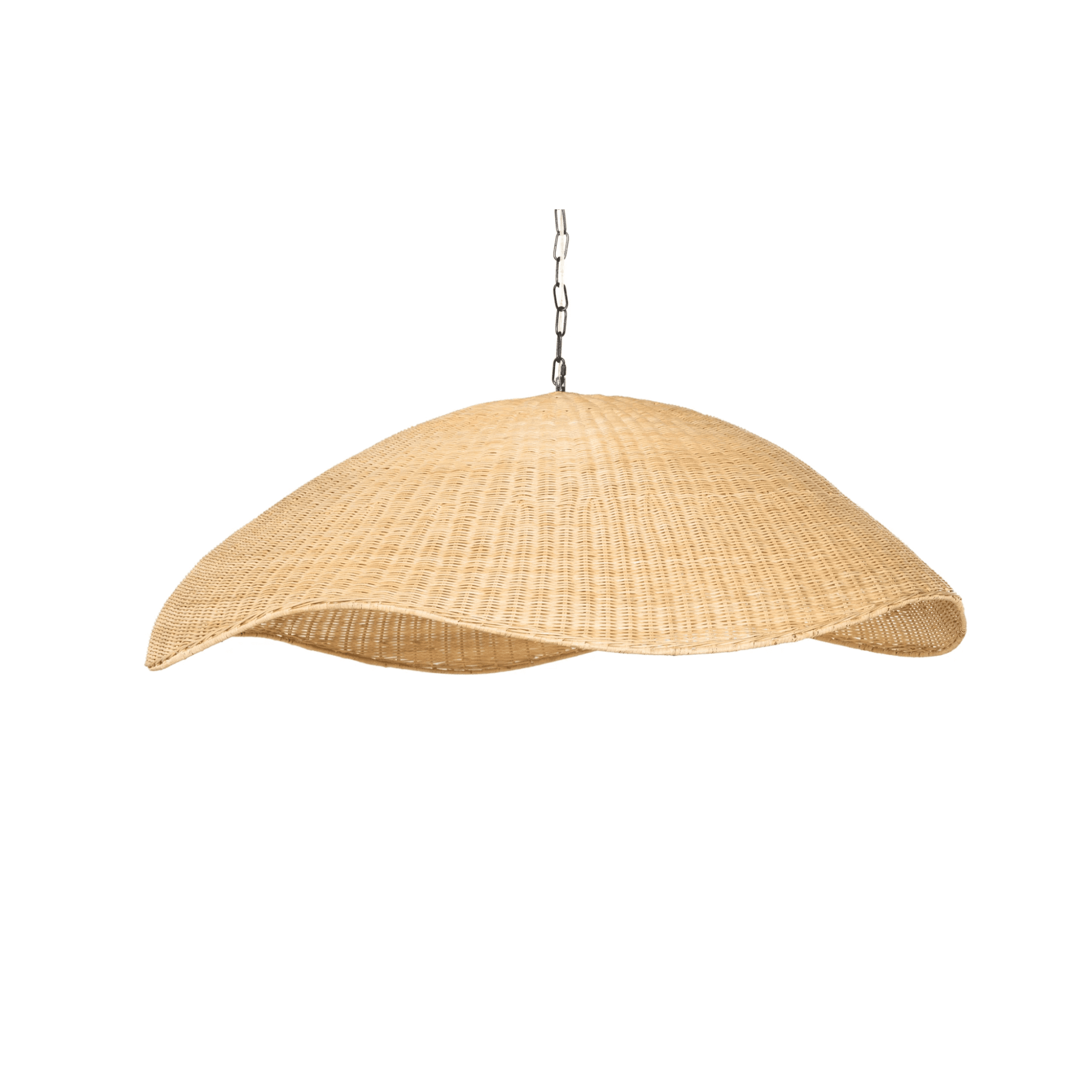 Artisan woven rattan chandelier with a sculptural open-weave dome casting soft ambient light in a boho living room